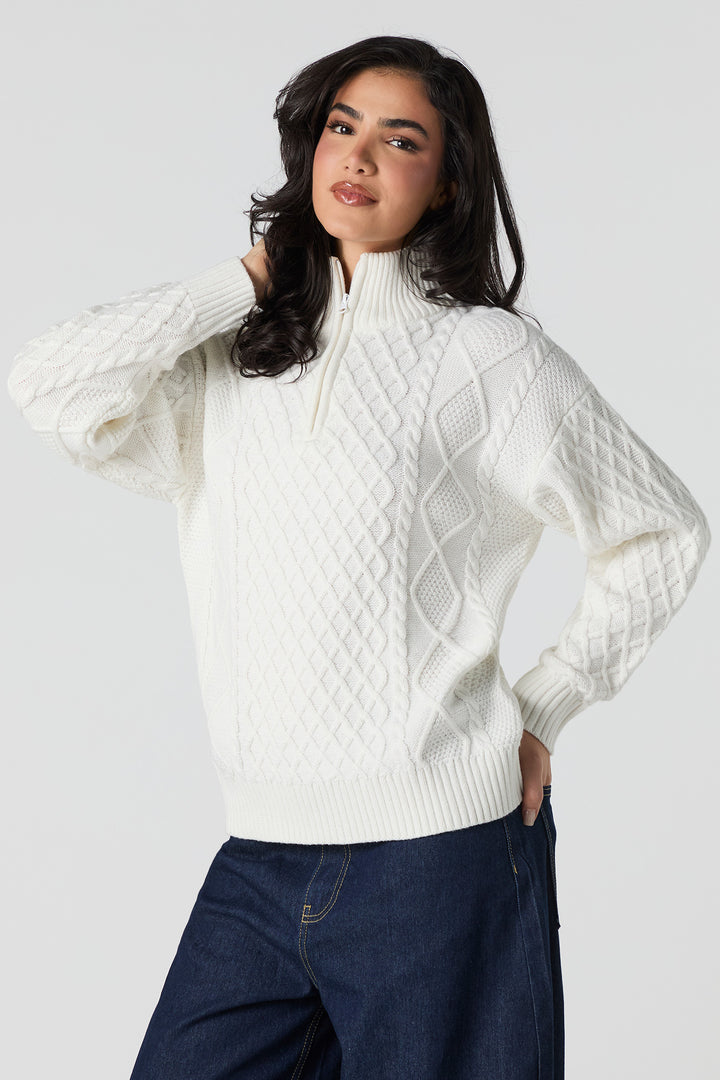 Chandail en tricot mailles torsadées et glissière un quart