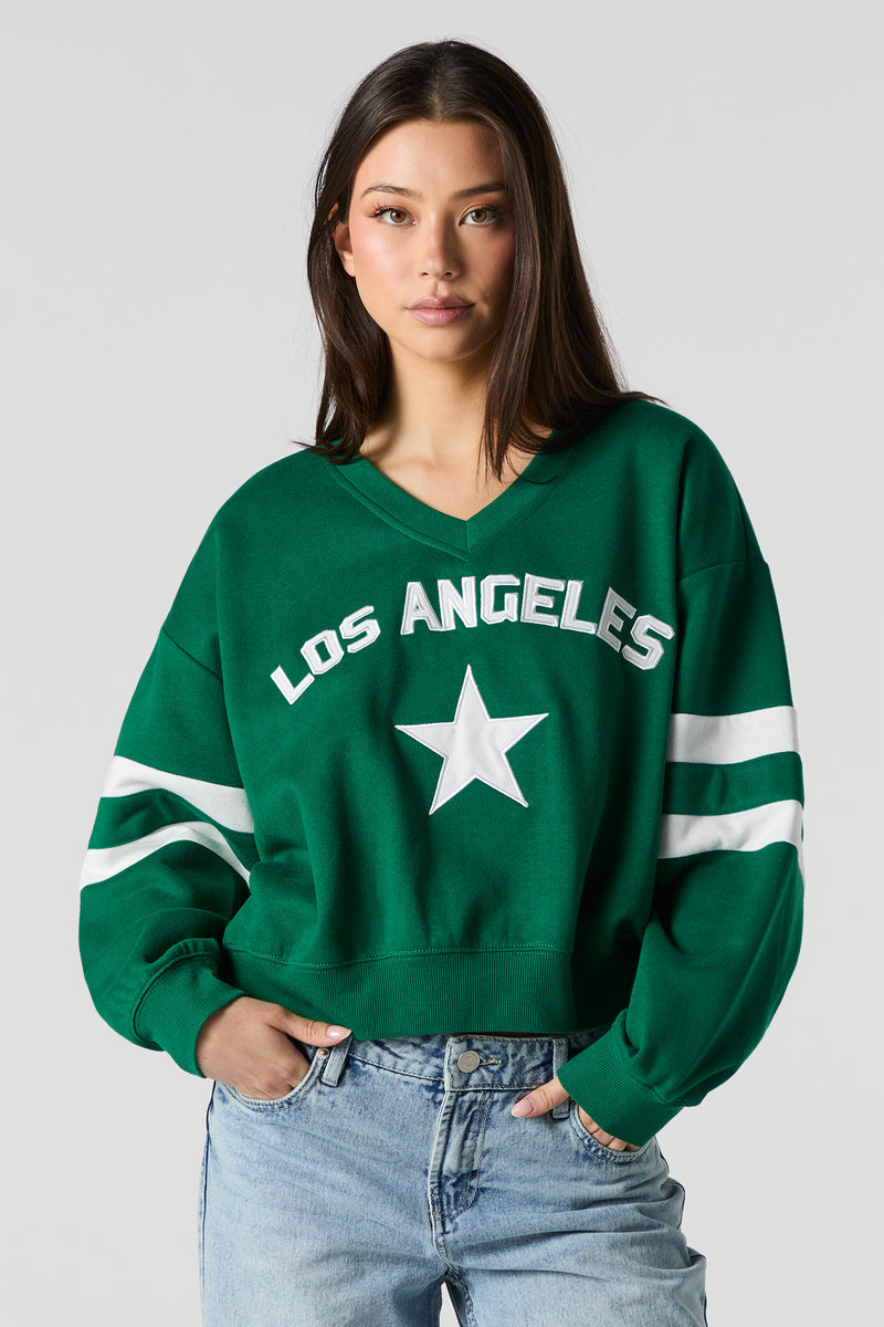 Chandail court en molleton avec motif brodé