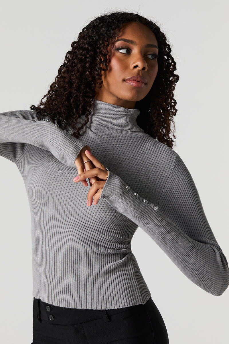 Chandail côtelé à manches boutonnées avec col roulé