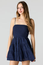 Minirobe smockée avec oeillets