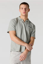 Polo en tricot gaufré brodé