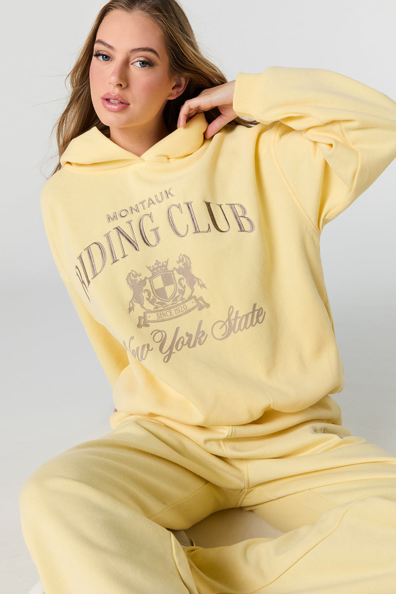 Haut à capuchon en molleton surdimensionné à imprimé Destination