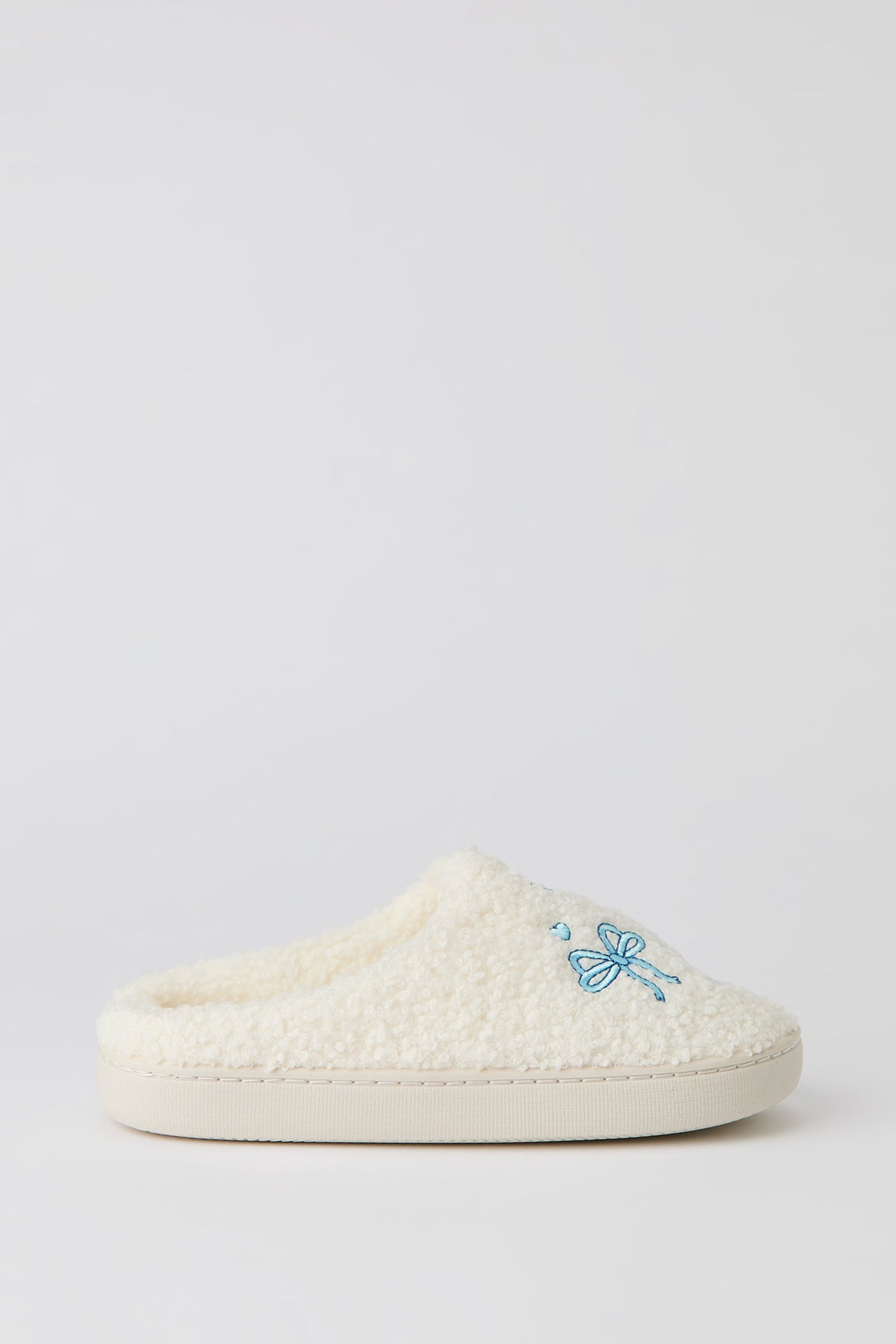 Pantoufles en Sherpa avec boucles