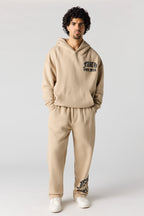 Pantalon d'entraînement à jambe large en molleton imprimé