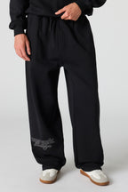 Pantalon d'entraînement baggy en molleton imprimé