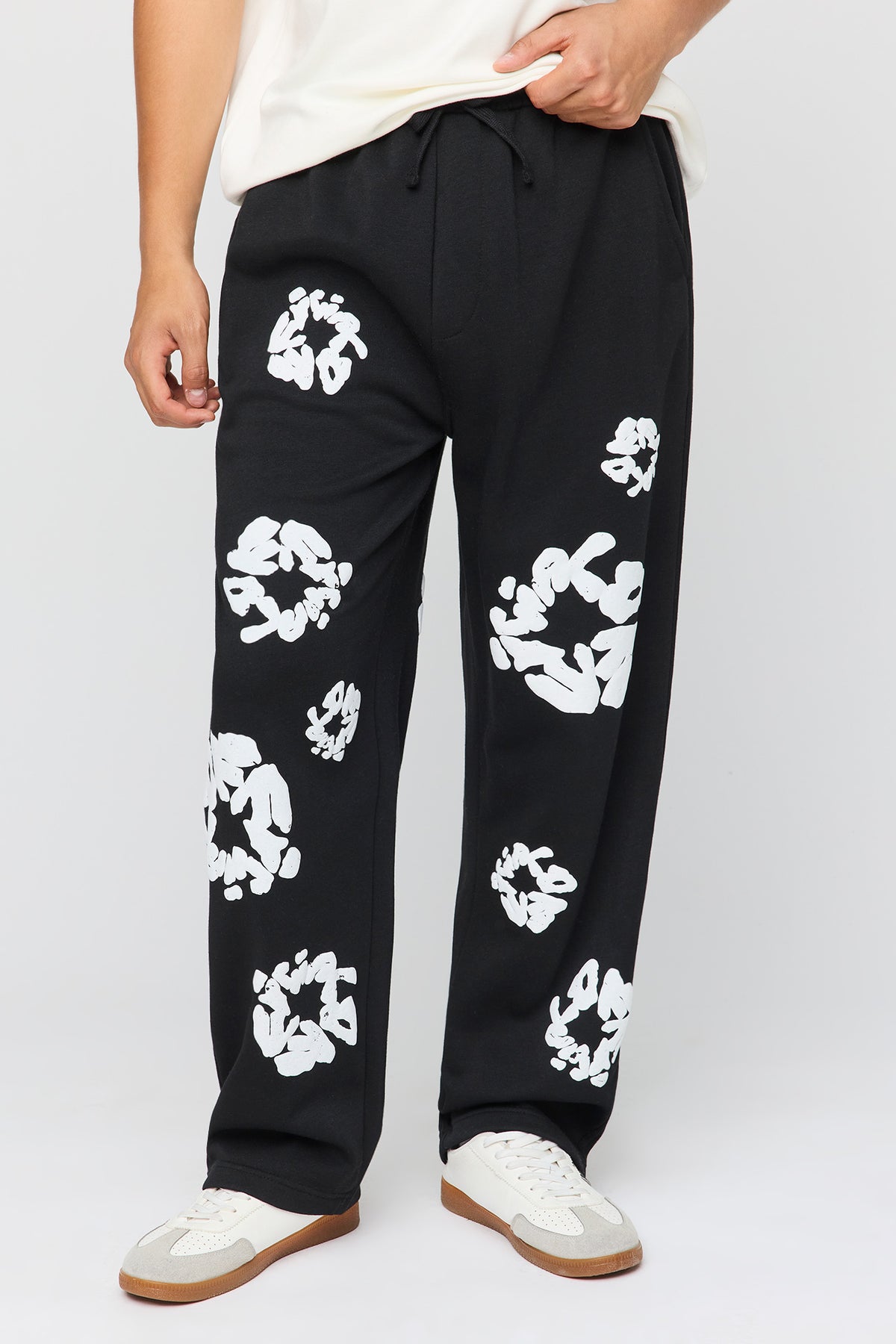Pantalon d'entraînement ample en molleton imprimé