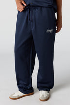 Pantalon d'entraînement texturé avec motif brodé