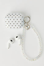 Ensemble avec écouteurs Bluetooth et accessoire