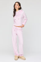 Ensemble avec haut à capuchon en velours à imprimé Juicy Couture et pantalon