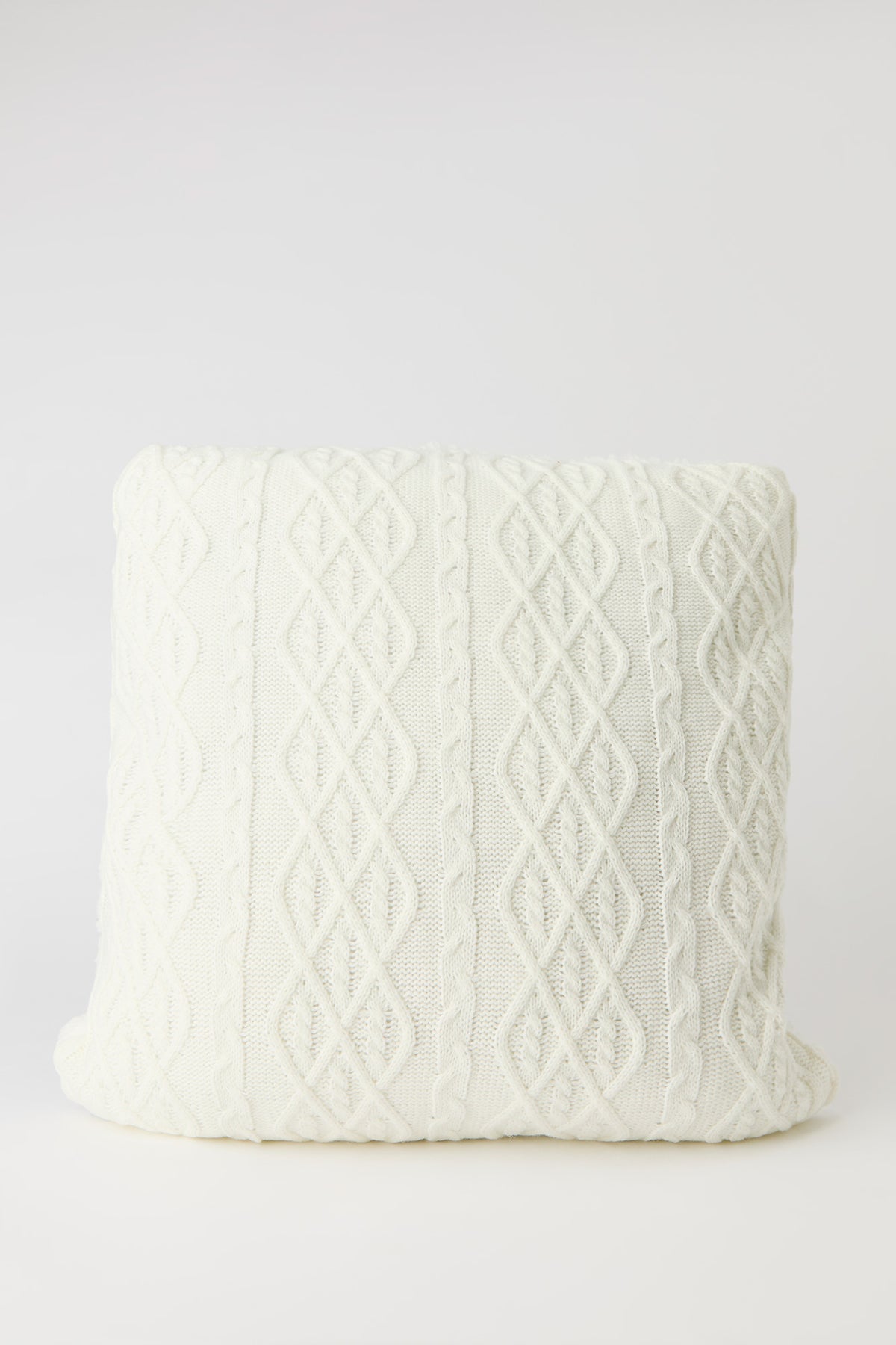 Coussin en tricot torsadé
