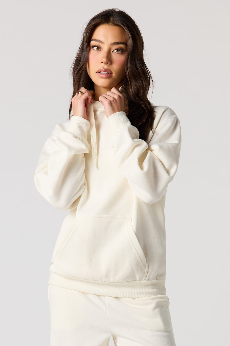 Haut surdimensionné à capuchon en molleton