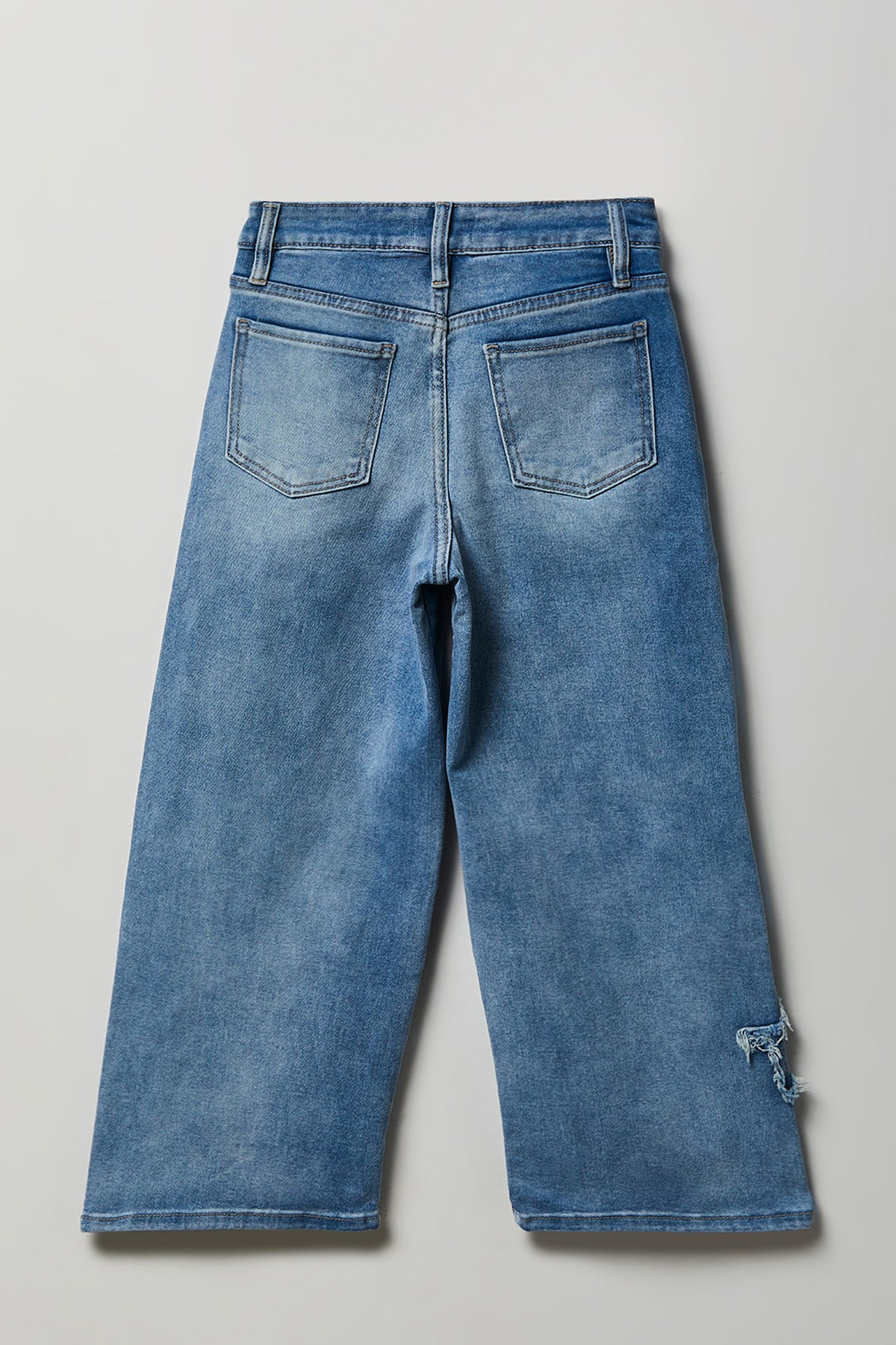 Alt View 2. Girls Stretch Star Patch Baggy Jean - Light Denim Blue
