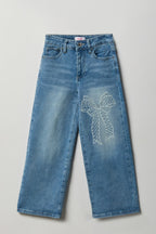 Jean baggy extensible avec boucle ornée de pierres du Rhin pour fille